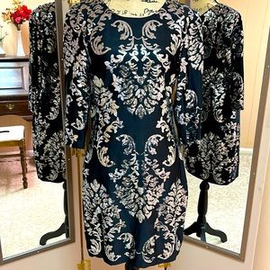 B Darlin size medium to large black and silver cocktail dress.